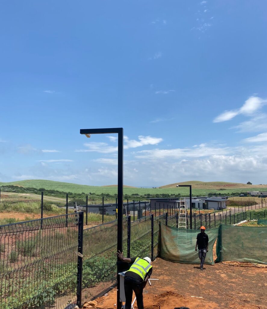 Stealth security CCTV technician installing balize estate